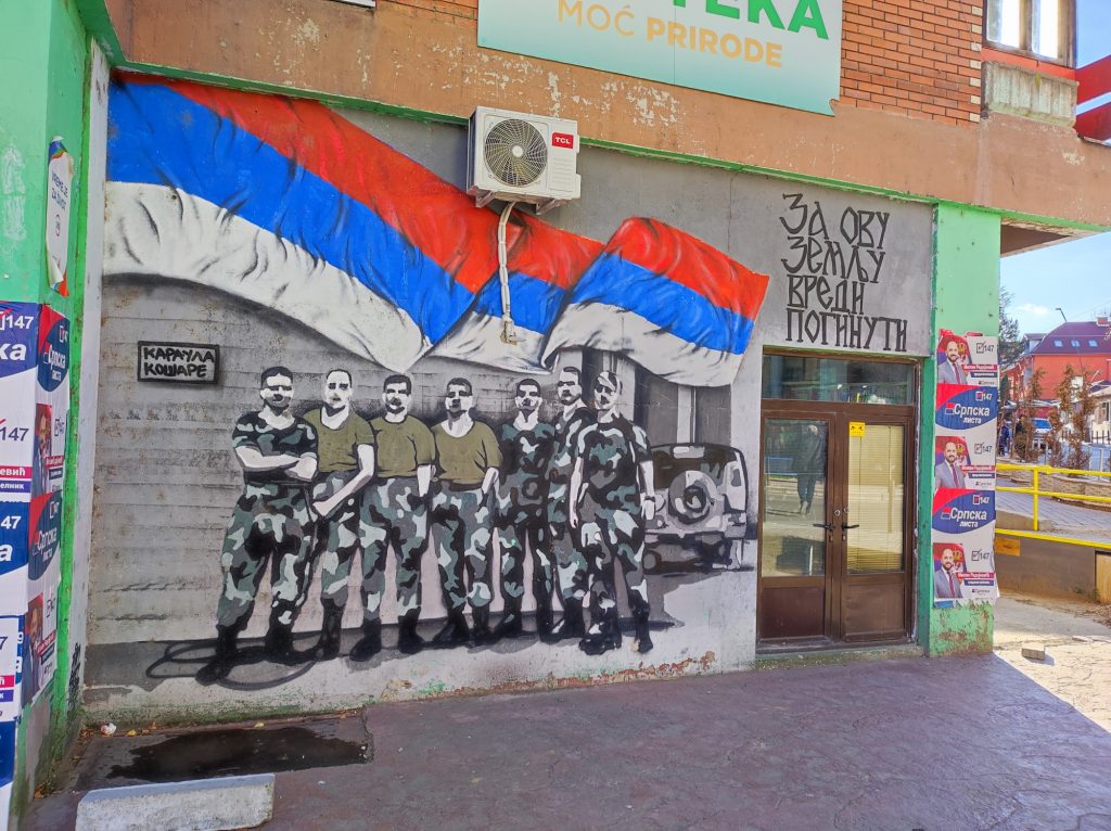 A mural with the Flag of Serbia in Mitrovica.