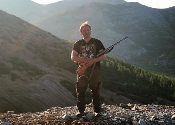 A bear hunter with his gun in Magadan, Russia