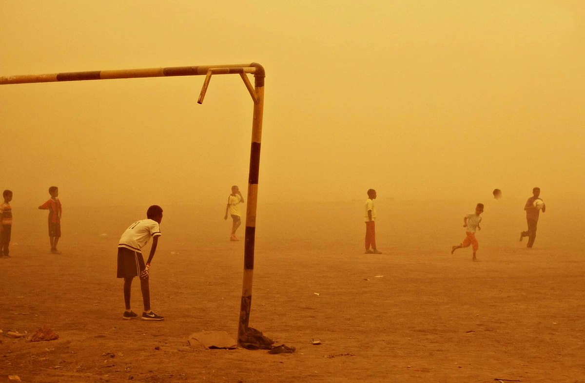 Kids playing football in Sudan