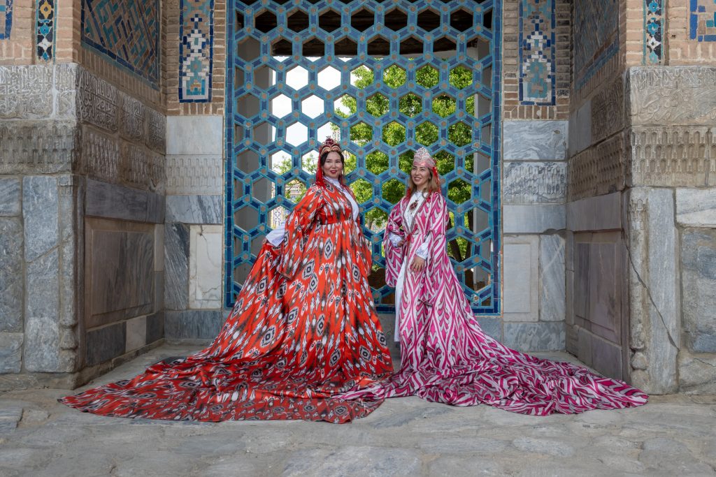 Uzbek Women pose in National Dress in Samarkand, Uzbekistan Packing List.