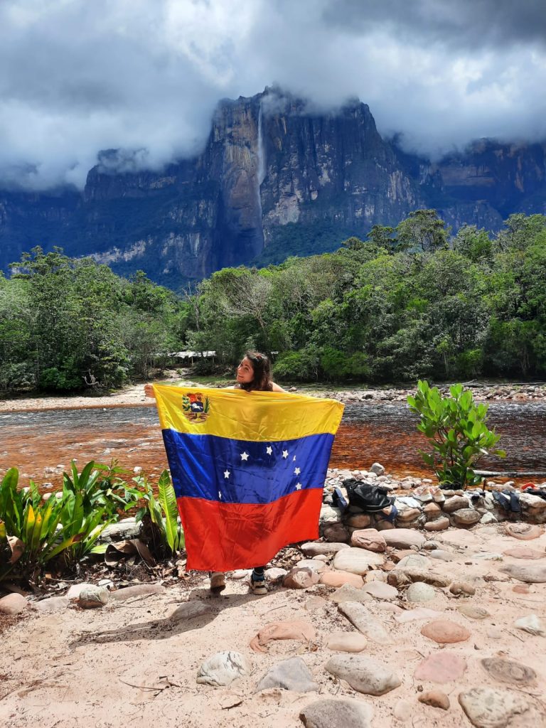 Visit Angel Falls - you have to get some Insta shots with the flag after a journey like this!