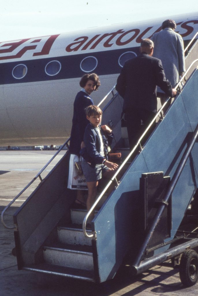 A group of tourists board a charter flight in Yugoslavia.