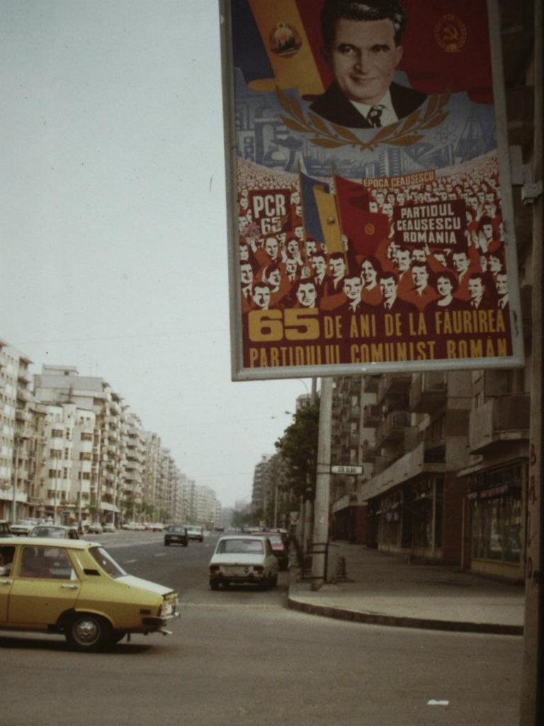 A propaganda poster hangs in Bucharest during the Ceausescu period.